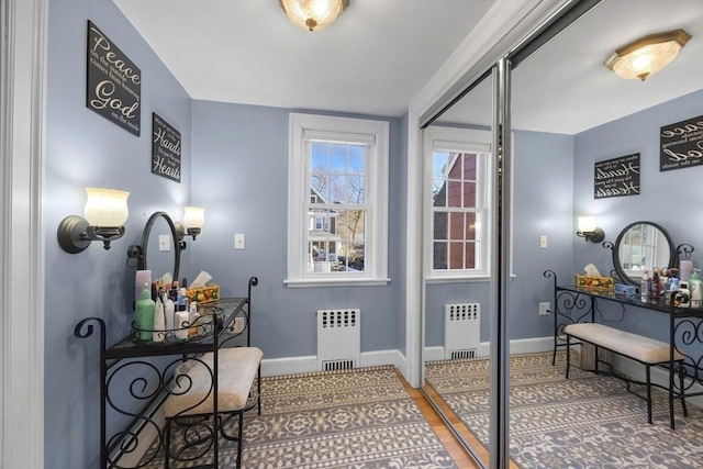 interior space featuring baseboards and radiator