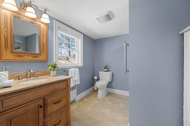 bathroom with visible vents, baseboards, toilet, radiator heating unit, and vanity