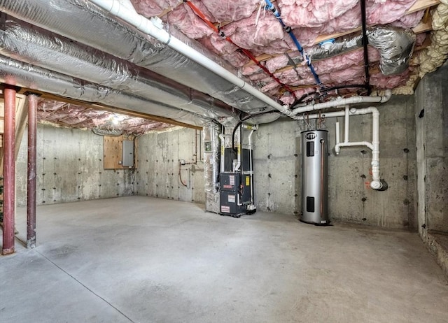 unfinished basement with heating unit, electric panel, and water heater