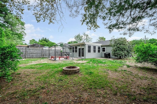5 Dirlam Cir, Tewksbury, MA 01876 - view of yard with an outdoor fire pit and a patio area
