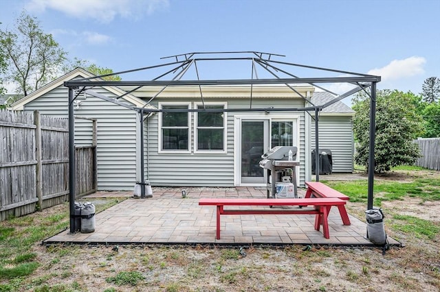 5 Dirlam Cir, Tewksbury, MA 01876 - rear view of property featuring a fenced backyard and a patio area