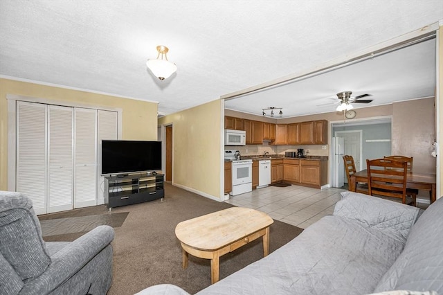 5 Dirlam Cir, Tewksbury, MA 01876 - living area with baseboards, ceiling fan, and light tile patterned floors