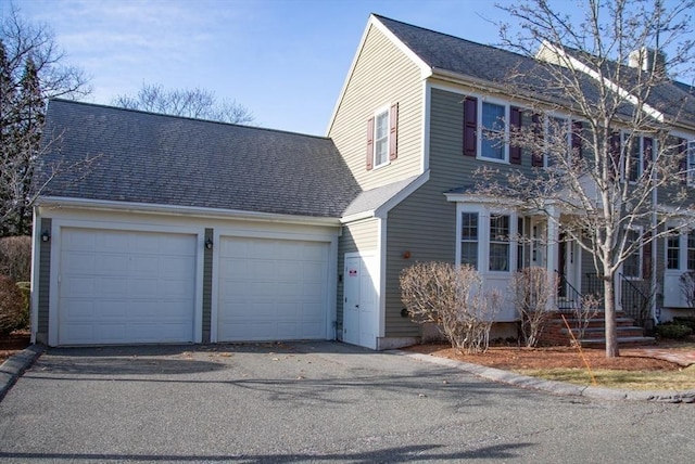 colonial inspired home featuring a garage