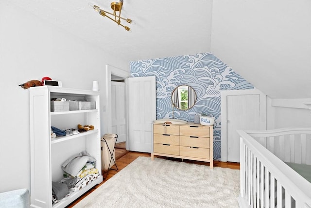 30 Highland St, Abington, MA 02351 - bedroom with wallpapered walls, wood finished floors, and vaulted ceiling