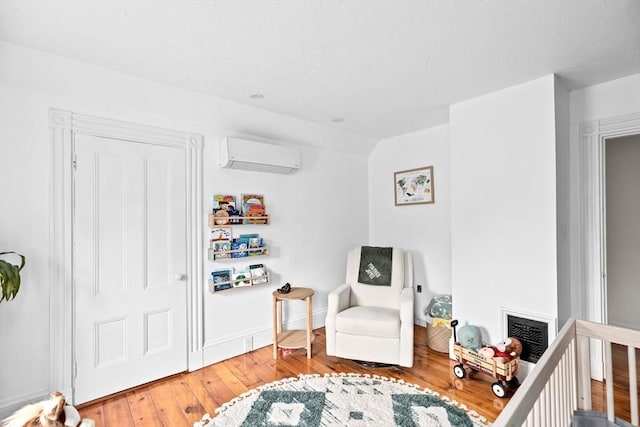 30 Highland St, Abington, MA 02351 - bedroom with an AC wall unit, wood-type flooring, and baseboards