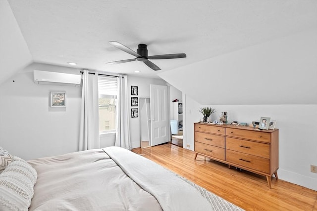 30 Highland St, Abington, MA 02351 - bedroom featuring lofted ceiling, light wood finished floors, a wall unit AC, baseboards, and recessed lighting