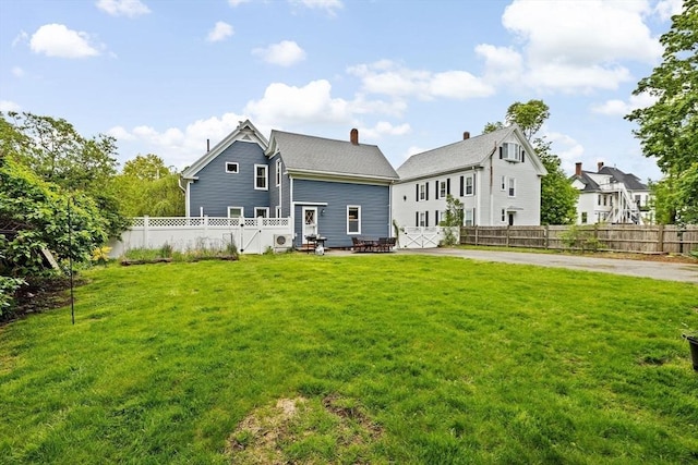 30 Highland St, Abington, MA 02351 - rear view of house with a chimney and a patio area