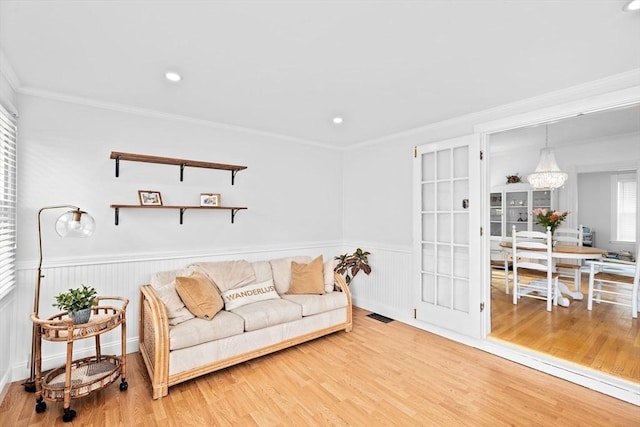30 Highland St, Abington, MA 02351 - living room with a wainscoted wall, wood finished floors, crown molding, a chandelier, and recessed lighting