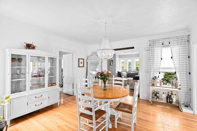 30 Highland St, Abington, MA 02351 - dining area featuring a chandelier, light wood-style floors, and ornamental molding