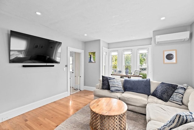 30 Highland St, Abington, MA 02351 - living room featuring a wall mounted air conditioner, light wood-style floors, recessed lighting, and baseboards
