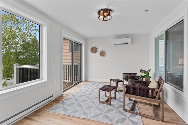 30 Cable Ave Unit B, Salisbury, MA 01952 - sunroom with a baseboard heating unit, a wall unit AC, plenty of natural light, and wood finished floors