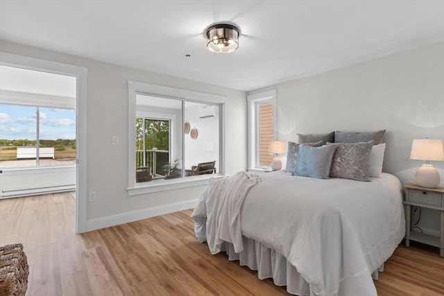 30 Cable Ave Unit B, Salisbury, MA 01952 - bedroom featuring a wall unit AC and light wood-type flooring