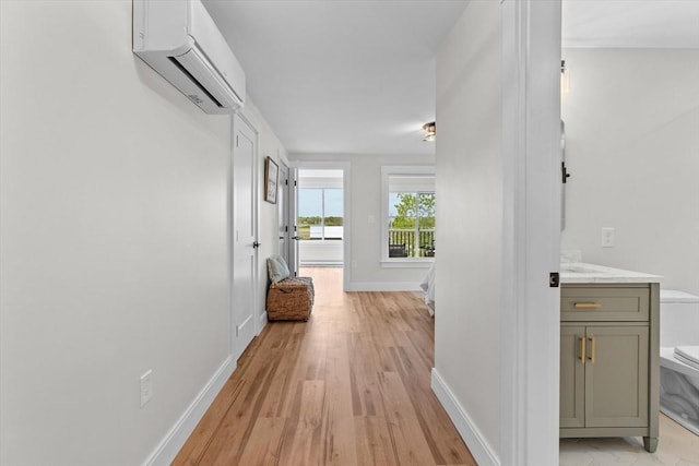 30 Cable Ave Unit B, Salisbury, MA 01952 - corridor featuring a wall mounted air conditioner and light wood-style floors