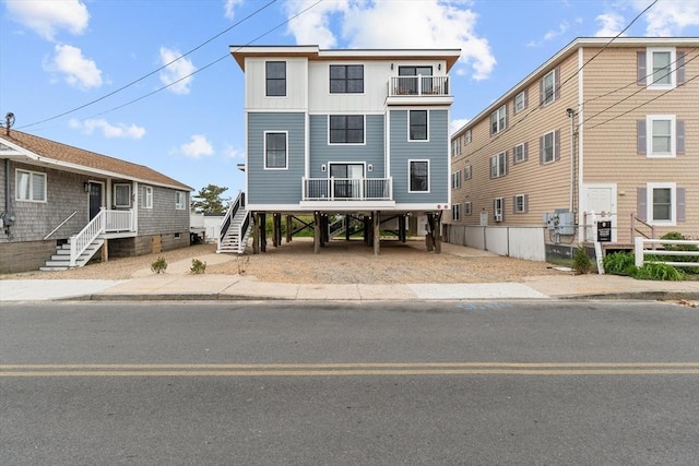30 Cable Ave Unit B, Salisbury, MA 01952 - coastal inspired home featuring stairs, a carport, and a balcony