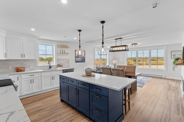 30 Cable Ave Unit B, Salisbury, MA 01952 - kitchen featuring baseboard heating, light wood-style flooring, a center island, white cabinetry, and recessed lighting
