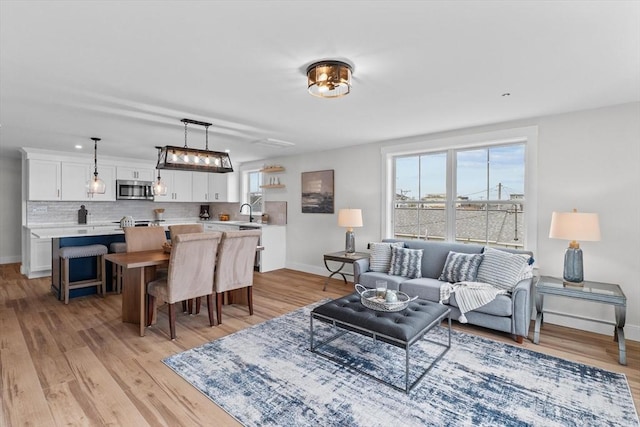30 Cable Ave Unit B, Salisbury, MA 01952 - living area with plenty of natural light and light wood-type flooring