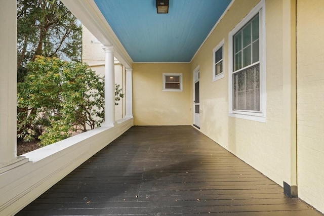 wooden terrace featuring an attached carport