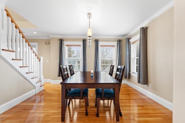 dining area with stairway, baseboards, recessed lighting, light wood-style floors, and crown molding