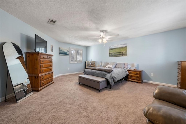 bedroom featuring light carpet, visible vents, and baseboards