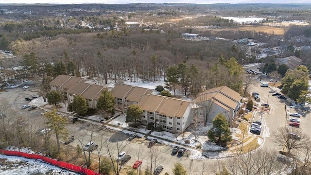 birds eye view of property featuring a forest view