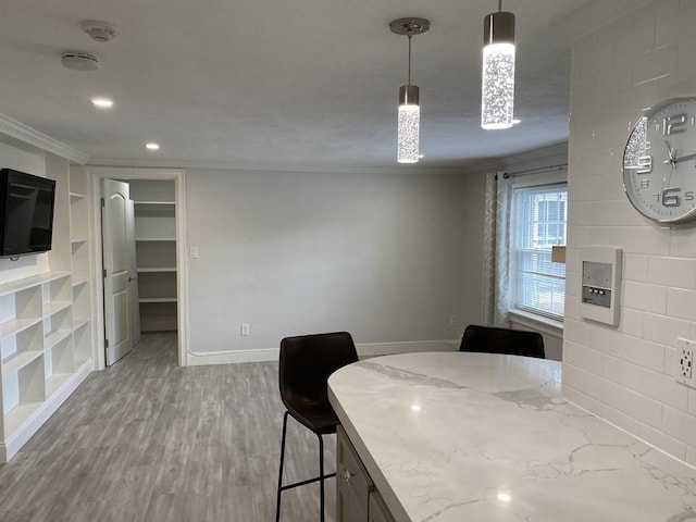 210 Hillside Ave Unit 37, Needham, MA 02494 - dining area with crown molding, wood finished floors, recessed lighting, and built in features