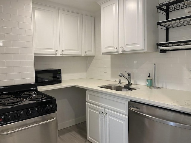 210 Hillside Ave Unit 37, Needham, MA 02494 - kitchen featuring stainless steel appliances, backsplash, and white cabinetry