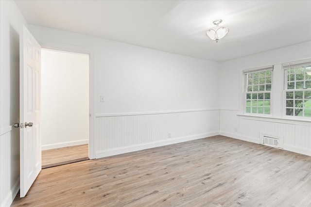 unfurnished room featuring light hardwood / wood-style flooring