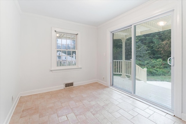 spare room featuring crown molding