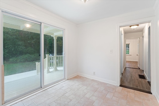 unfurnished room featuring light wood-type flooring and crown molding