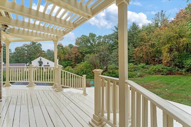 wooden deck featuring a pergola