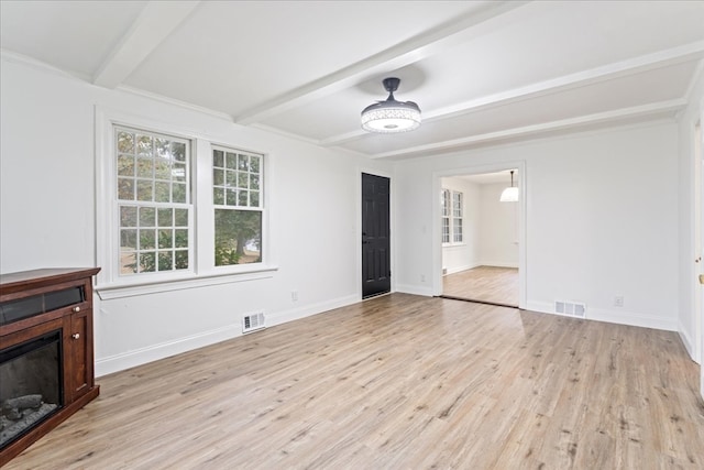 unfurnished living room with light wood-type flooring and beam ceiling