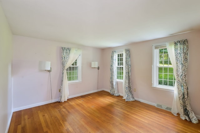 empty room with light wood-type flooring