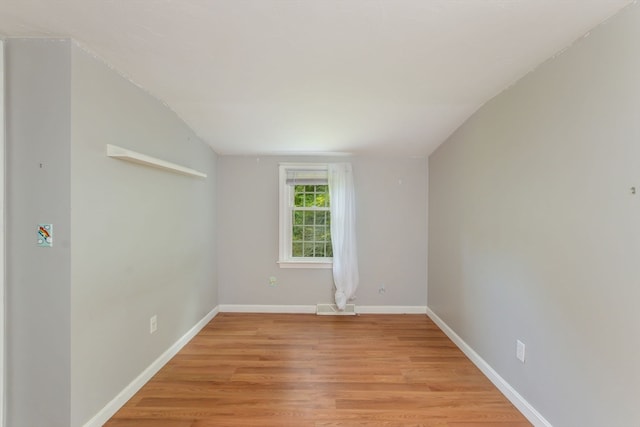 unfurnished room with light wood-type flooring