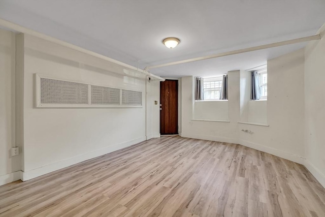 spare room featuring light wood-type flooring