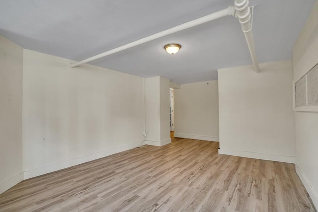 basement featuring light hardwood / wood-style flooring