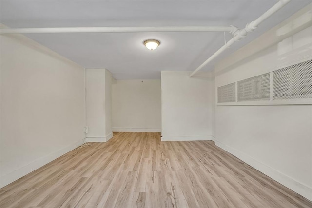 spare room featuring light hardwood / wood-style floors