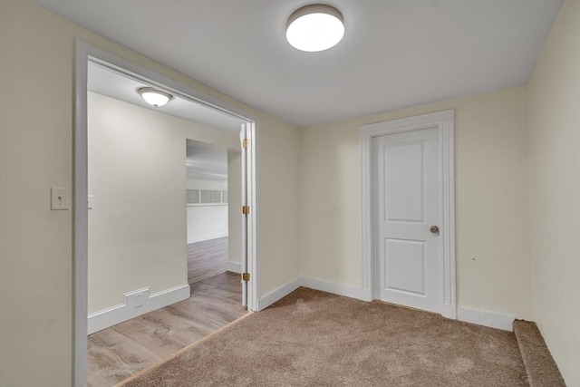 empty room with light colored carpet