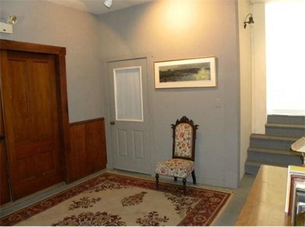 165 Main St, Charlemont, MA 01339 - foyer entrance with stairway and wainscoting