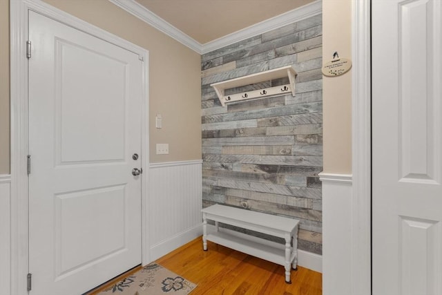 mudroom with crown molding and light hardwood / wood-style flooring