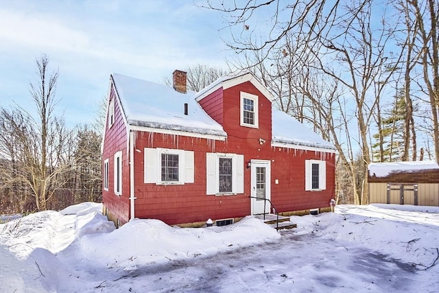 cape cod home with a chimney