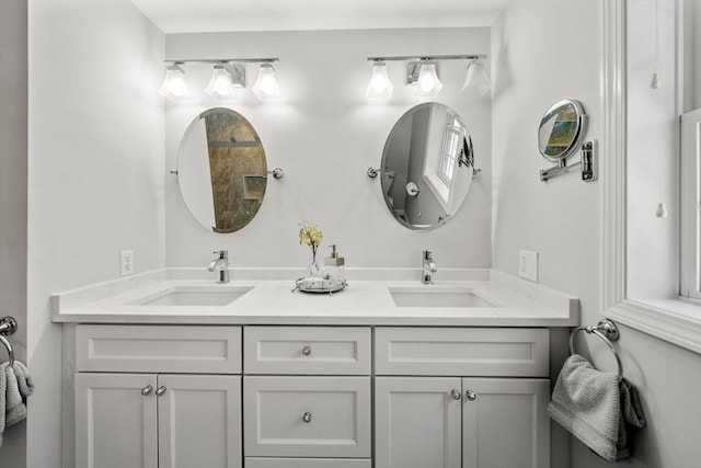 full bath featuring a sink and double vanity