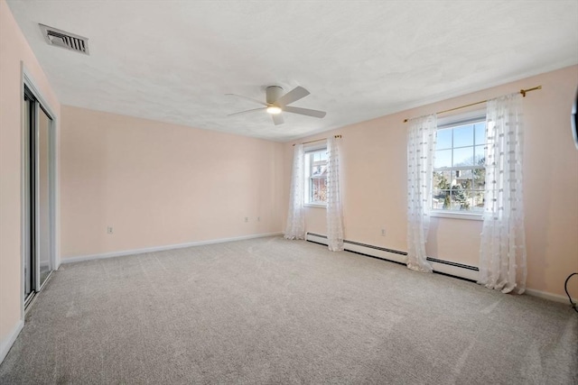 unfurnished room featuring light carpet, baseboards, visible vents, and a ceiling fan