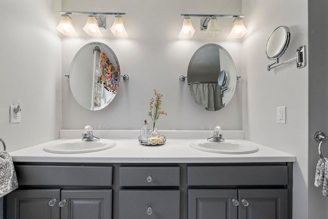 full bath with double vanity and a sink