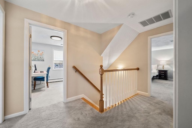 corridor featuring visible vents, carpet flooring, an upstairs landing, and baseboards