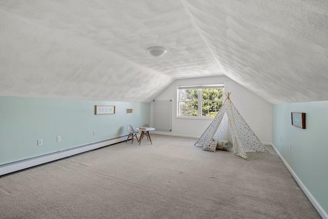 bonus room featuring a textured ceiling, vaulted ceiling, carpet flooring, and baseboards