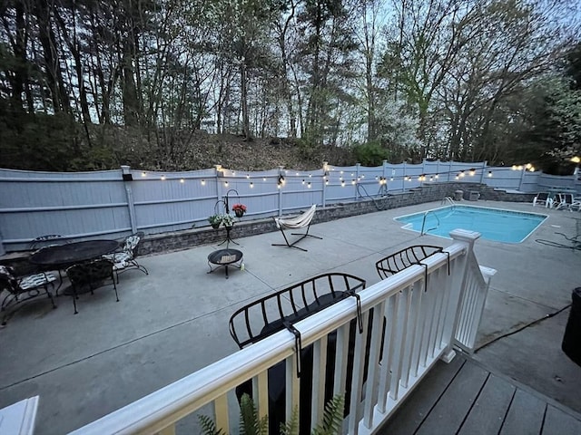 view of swimming pool with a fenced in pool, a patio area, and a fenced backyard