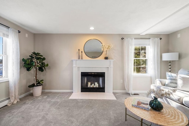 carpeted living area with a tile fireplace, baseboards, and recessed lighting