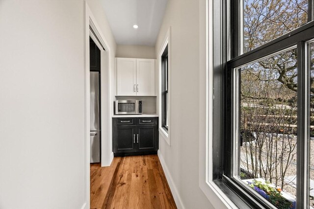 70 W Vine St, Provincetown, MA 02657 - hall with light wood finished floors, baseboards, and recessed lighting