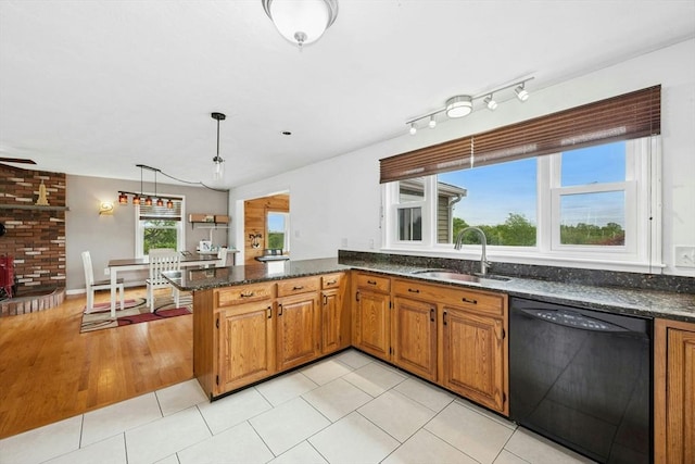 25 Piasta Rd, Dudley, MA 01571 - kitchen with dishwasher, a sink, brown cabinets, and a peninsula