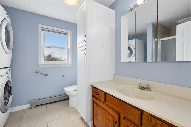 25 Piasta Rd, Dudley, MA 01571 - full bath with baseboard heating, estacked washer and dryer, a stall shower, vanity, and toilet